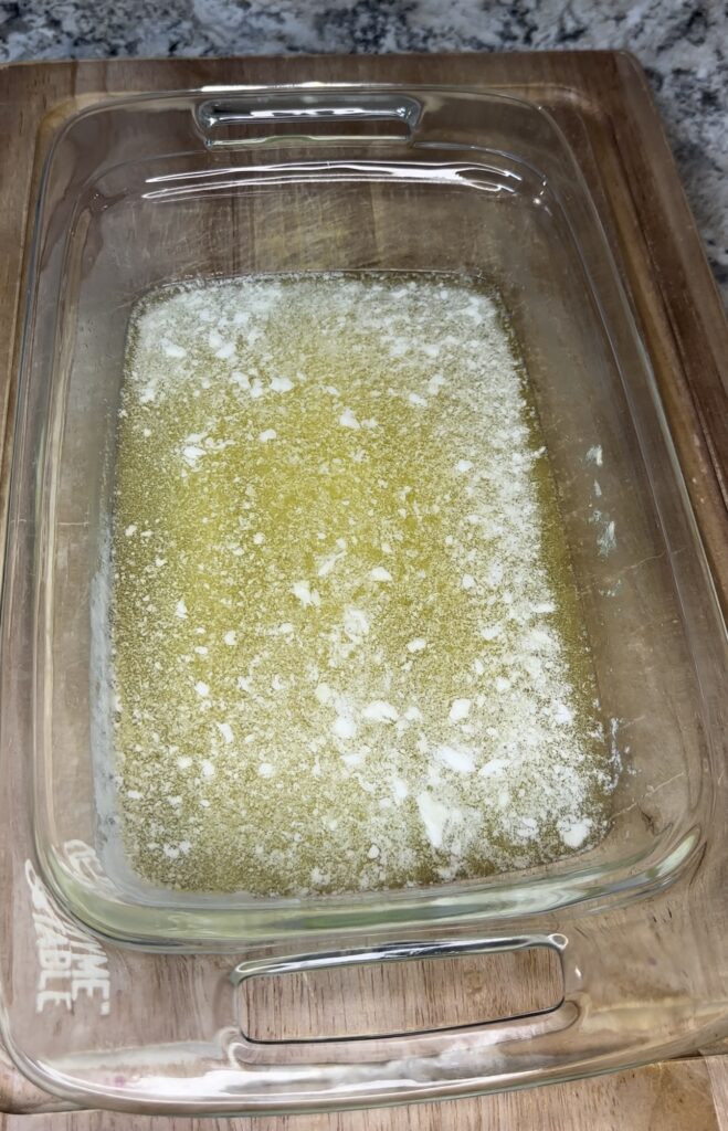 melted butter in baking dish