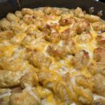 skillet of cheesy tater tot casserole