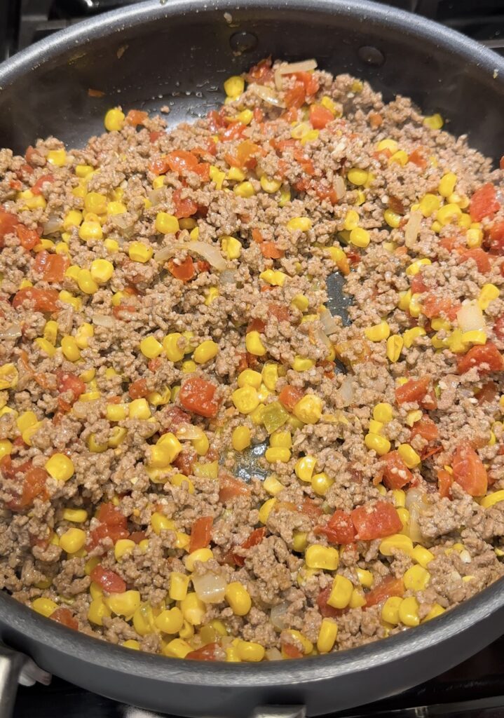 ground beef combined with corn and Rotel