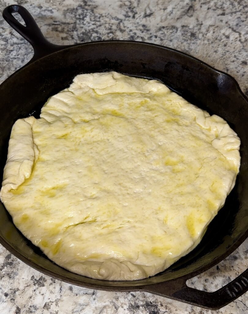 pizza dough in the skillet