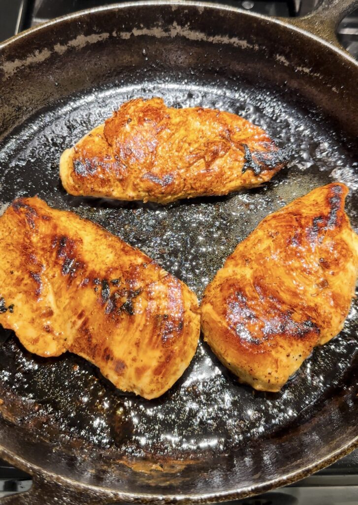 chicken cooking in the skillet