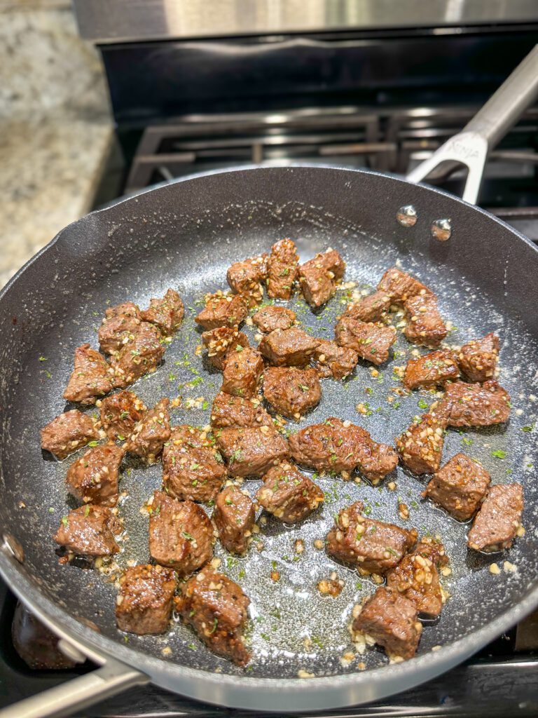 steak bites tossed in garlic butter sauce