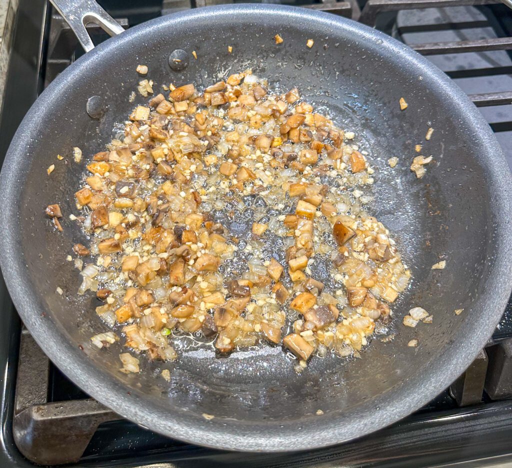 mushroom and onion cooking I bacon grease